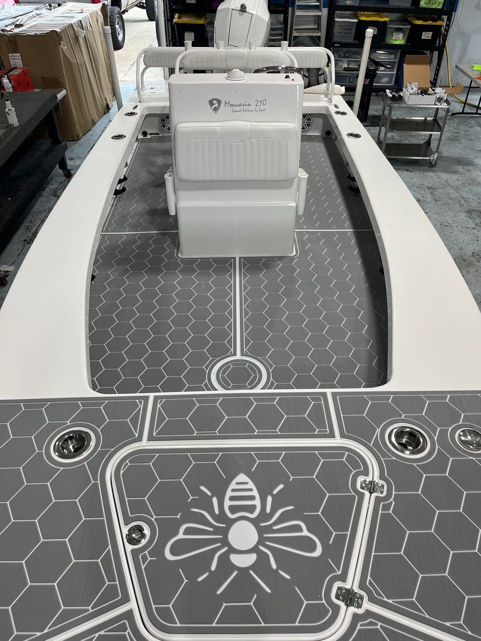 Hexagon pattern and bee logo detail, identified as a Maverick 210 on the current MarineDex website.
