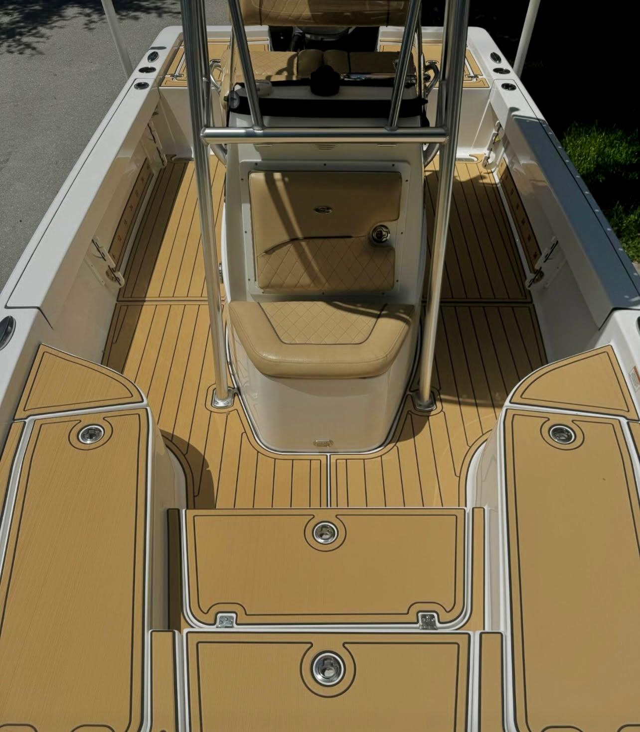 Center console boat decked in Camel SeaDek with White routing, featuring a clean nonskid pattern across the bow, cockpit, and helm areas.