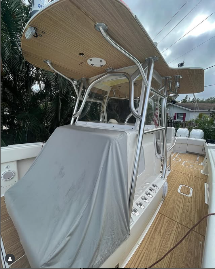 Boat deck showing custom SeaDek in a faux teak pattern in Mocha tone, with wood-grain planks and hatch panels.